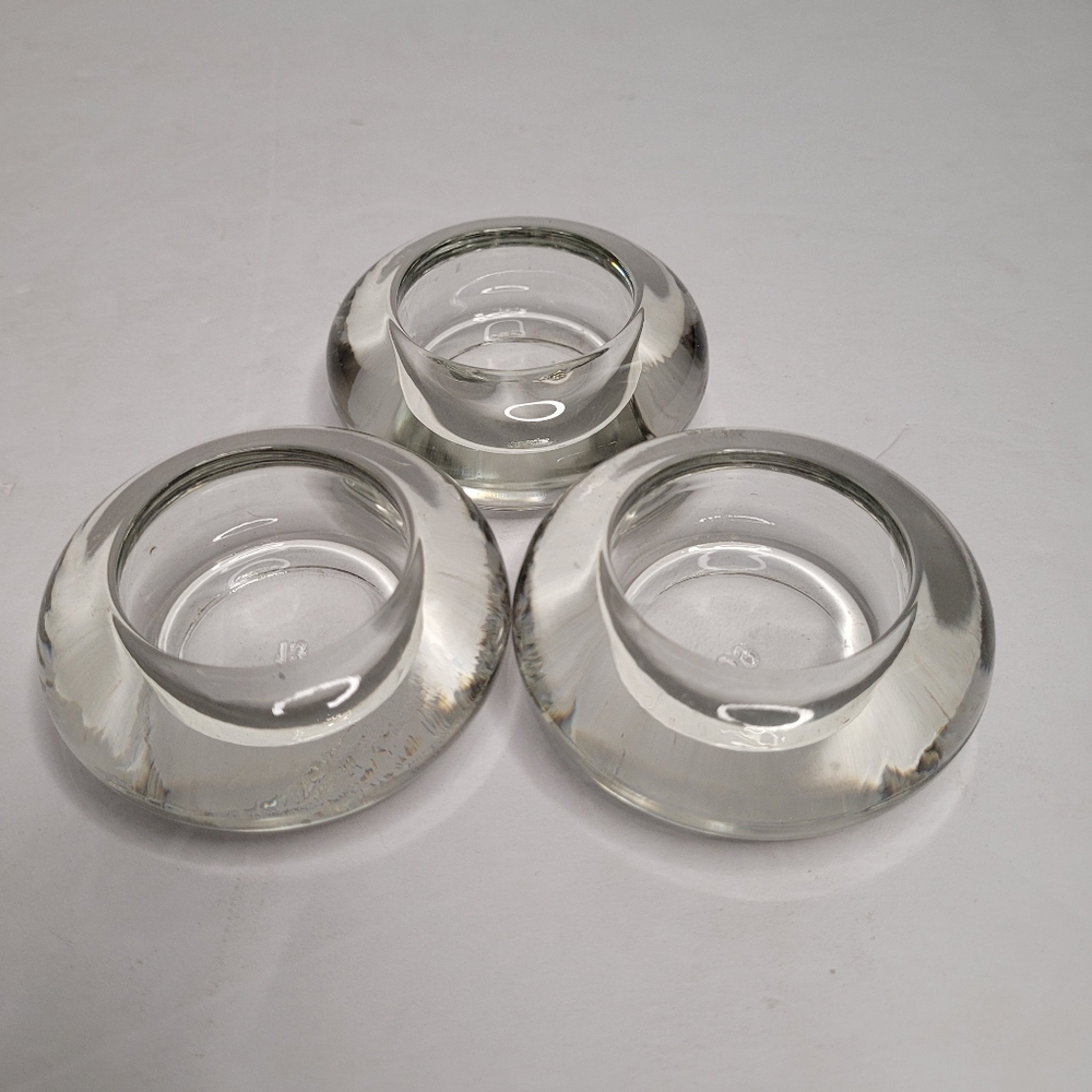3 clear glass candle holders. 286